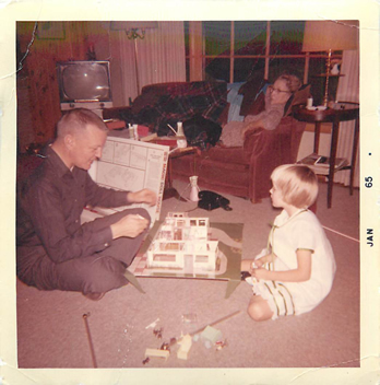 The author as a child with her dollhouse